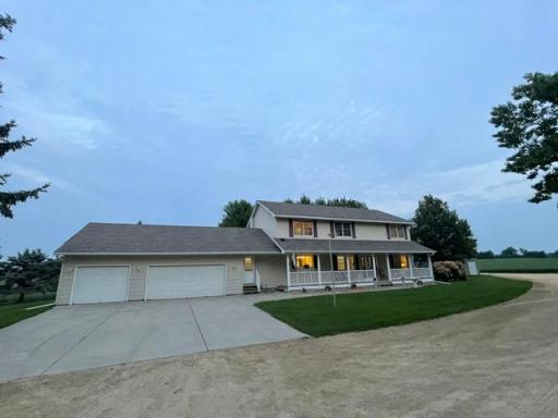 34' X 30' garage, insulated and fully sheetrocked with service door out to backyard. PLUS generous sized concrete parking area, with sidewalk to front door or service door off mudroom.