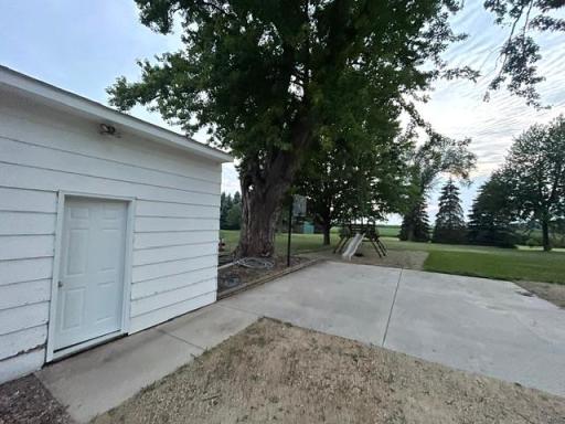 Additional 2 stall garage with new roof and service door. Separate concrete slab for basketball hoop or parking