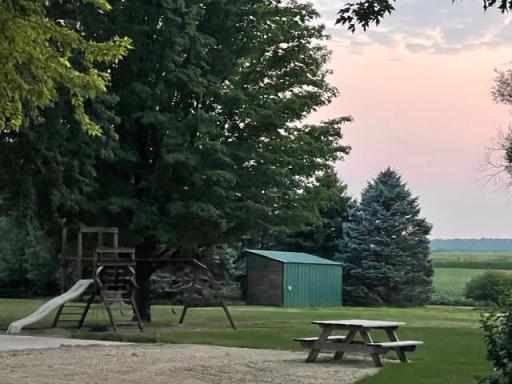 Your own park includes picnic table, swingset, and basketball hoop on concrete slab, plus a chicken coop shed