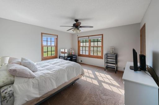 #5 bedroom with two windows and ceiling fan