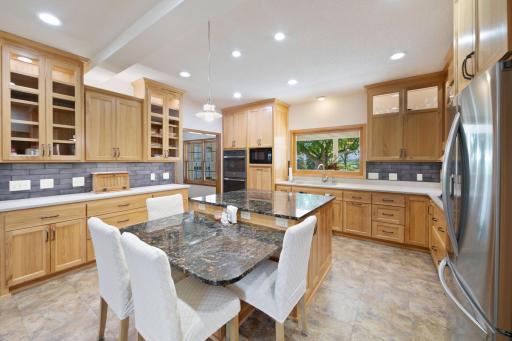 No lack of seating/ eating space in this home. Ideal center island work space, with drop down table height w/ seating for 4