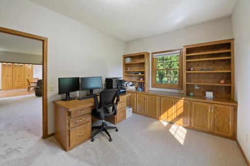 Great in home office space, or room for the kids to do their homework. Windows on two walls, built in cabinets and shelving, plus desk already there for you.