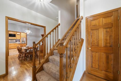 Open railing off entry between dining room and flex room- Stairs to upper level 4 bedrooms and 2 baths