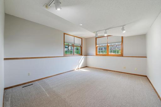 Seperate room with free standing wall to separate family room for flex room. In home office, toy room or Ideal for exercise room/ equipment. Enjoy this space while getting to see different views of the outside