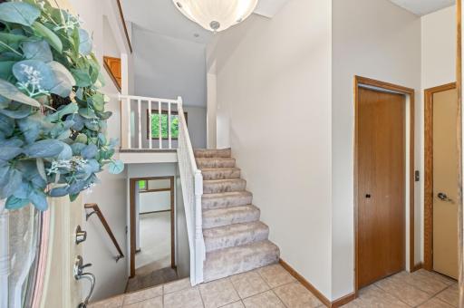 Large entryway with closet and access to the attached 3 stall garage
