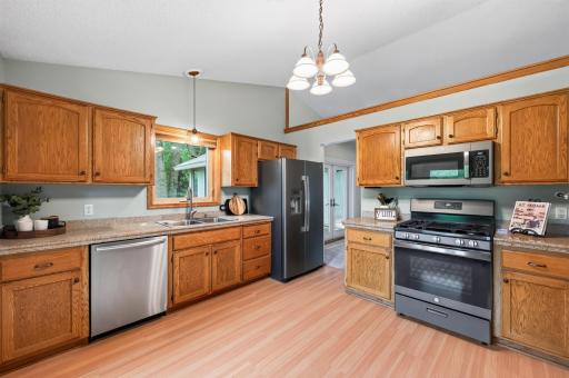 Great kitchen with granite tile countertops, newer stainless steel appliances, plenty of storage and room for a table too!
