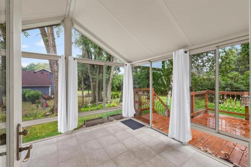 Amazing glass sun room overlooking the beautiful yard