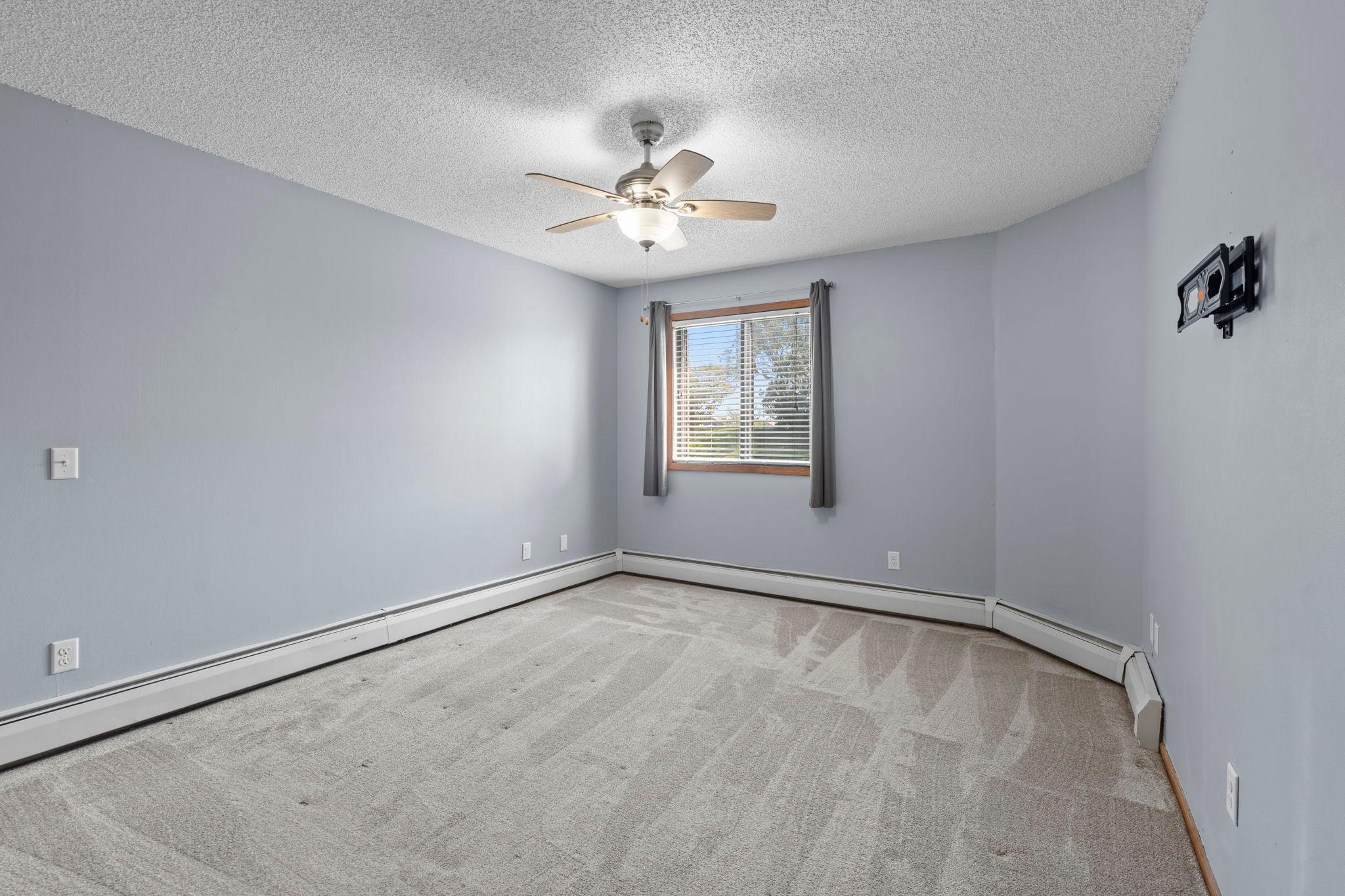 Two generously sized bedrooms provide plenty of space, including a spacious primary bedroom.