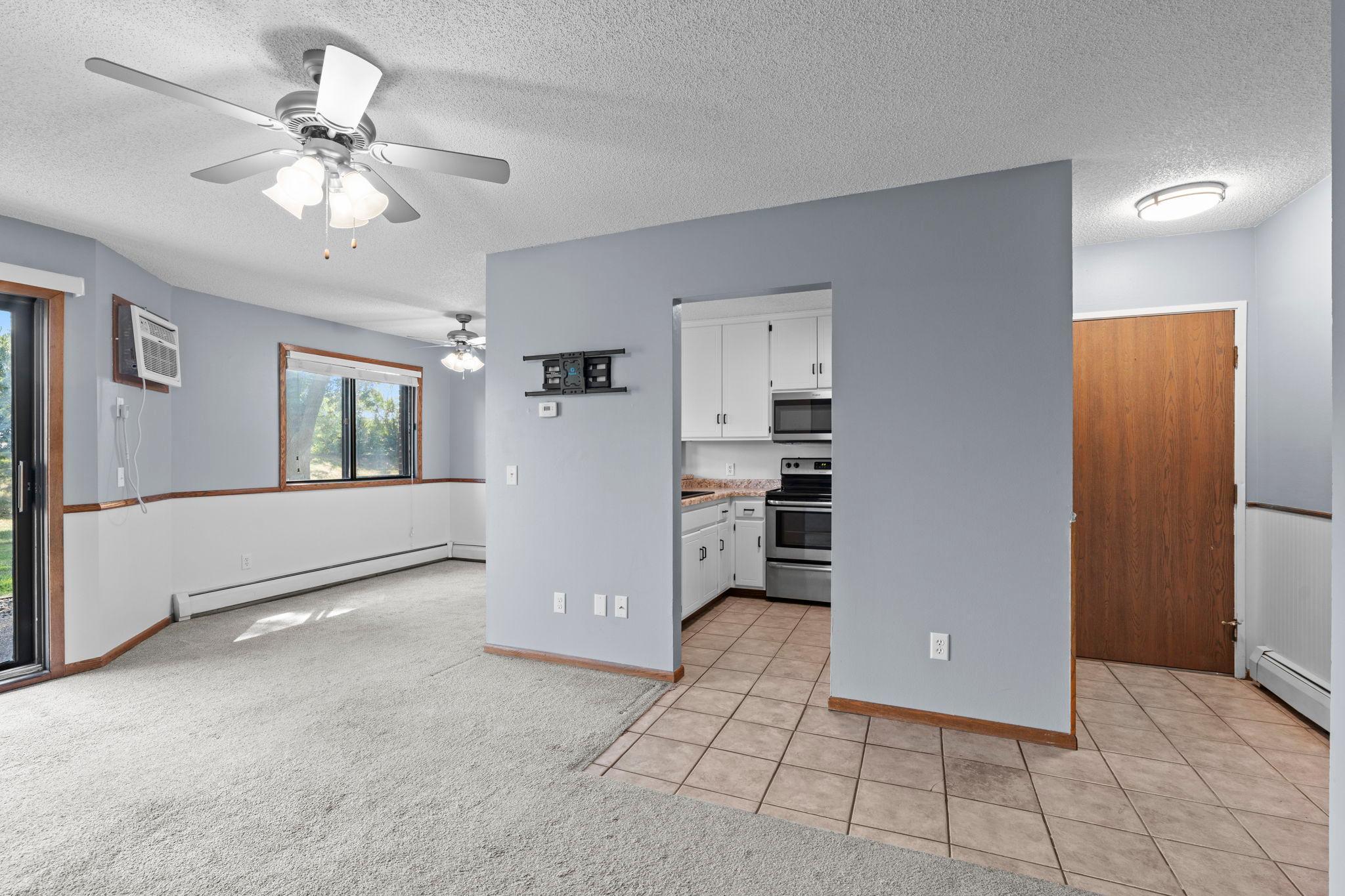 Upon entering, you’re greeted by durable tile flooring that flows into the kitchen.