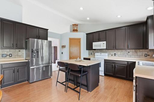 The kitchen and dining area is great with plenty of cabinet space, an island, and a pantry