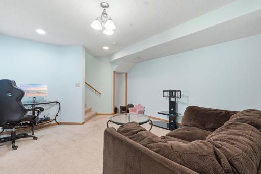 Come downstairs to experience even more space! This is a fun game room just off the stairs.