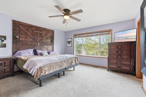 Primary bedroom has great space, and a large walk-in closet and bathroom. Headboard can stay if interested.