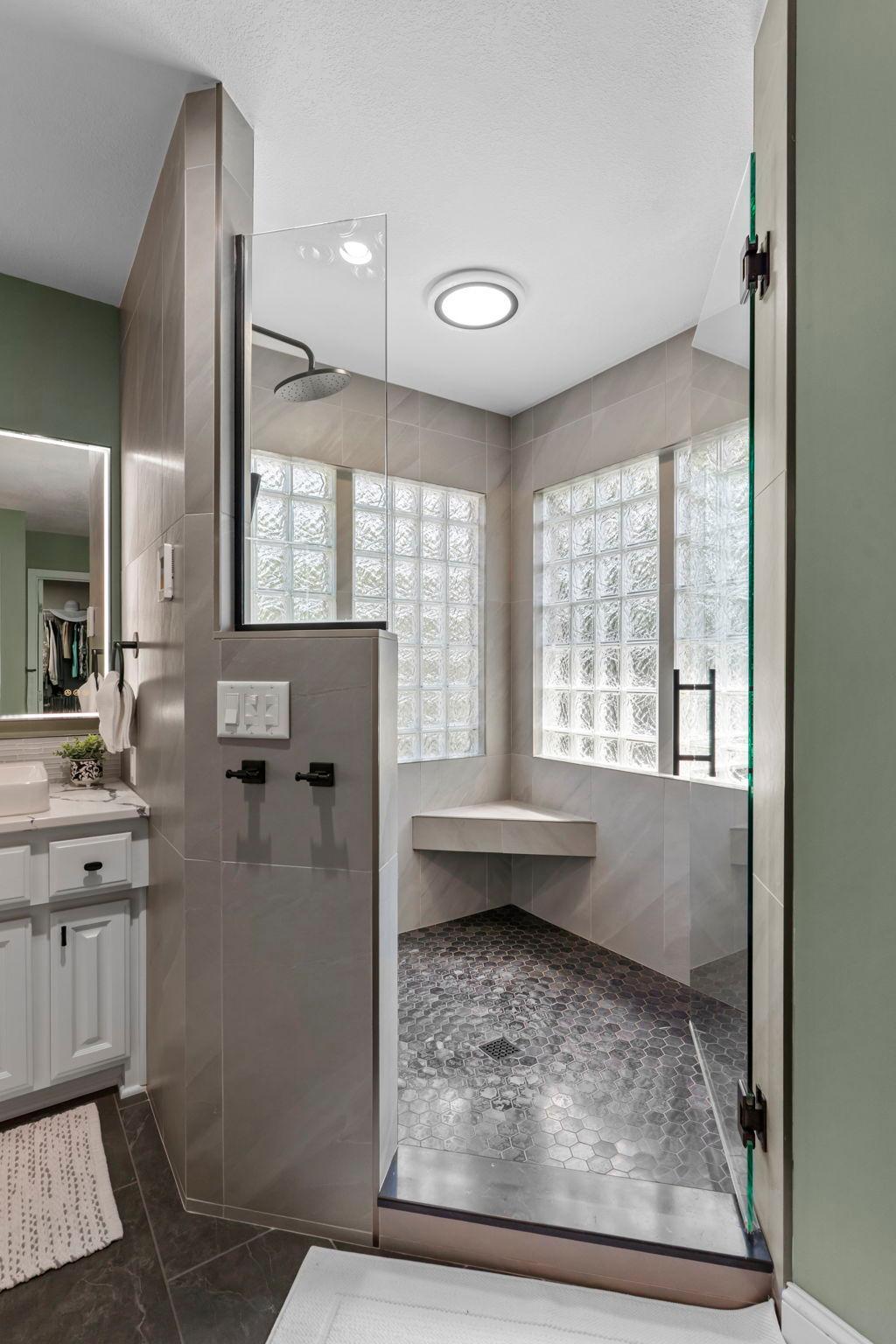 A closer look at the spa-like oversized tiled walk-in shower.