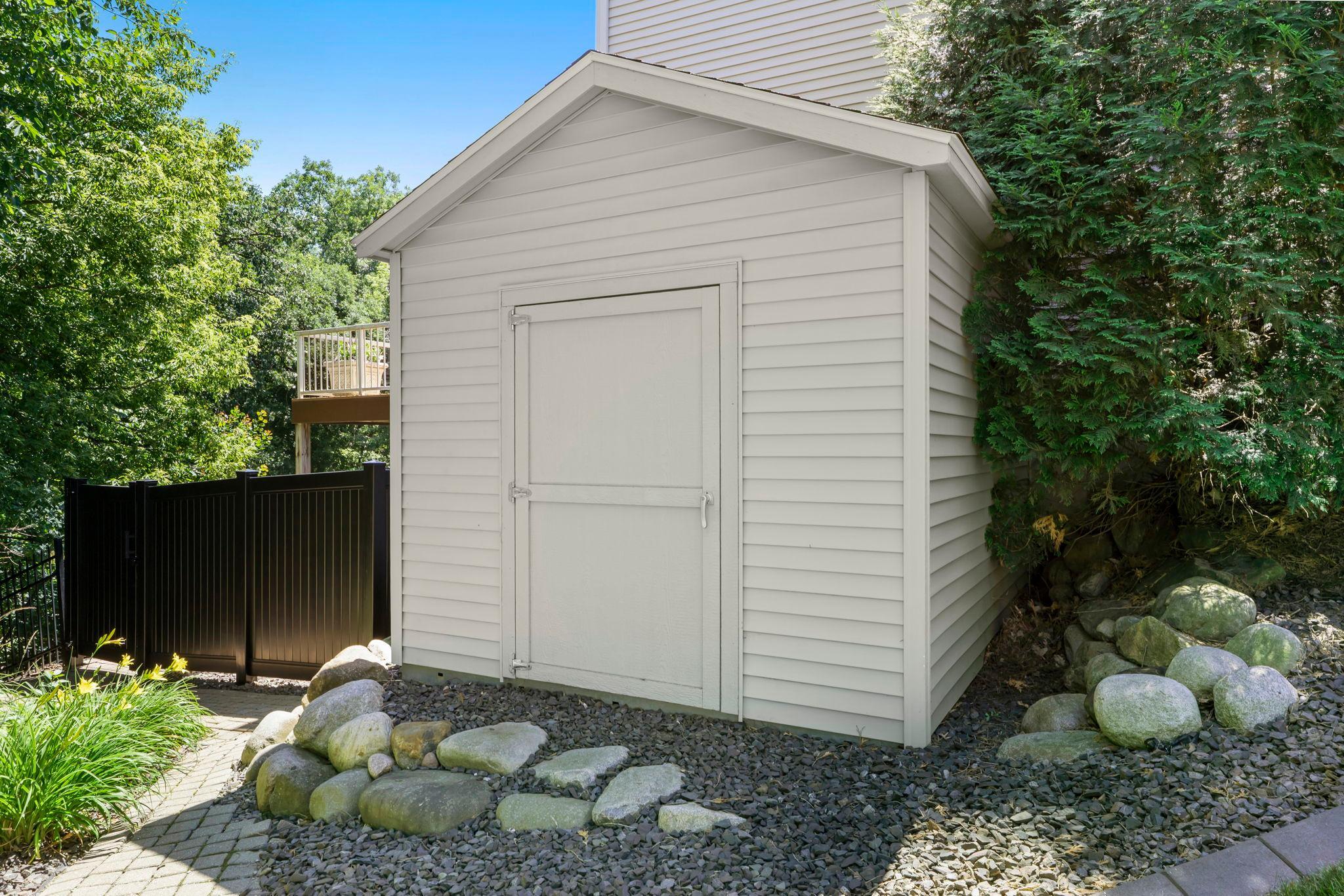 Convenient outdoor shed providing ample storage for all your needs.