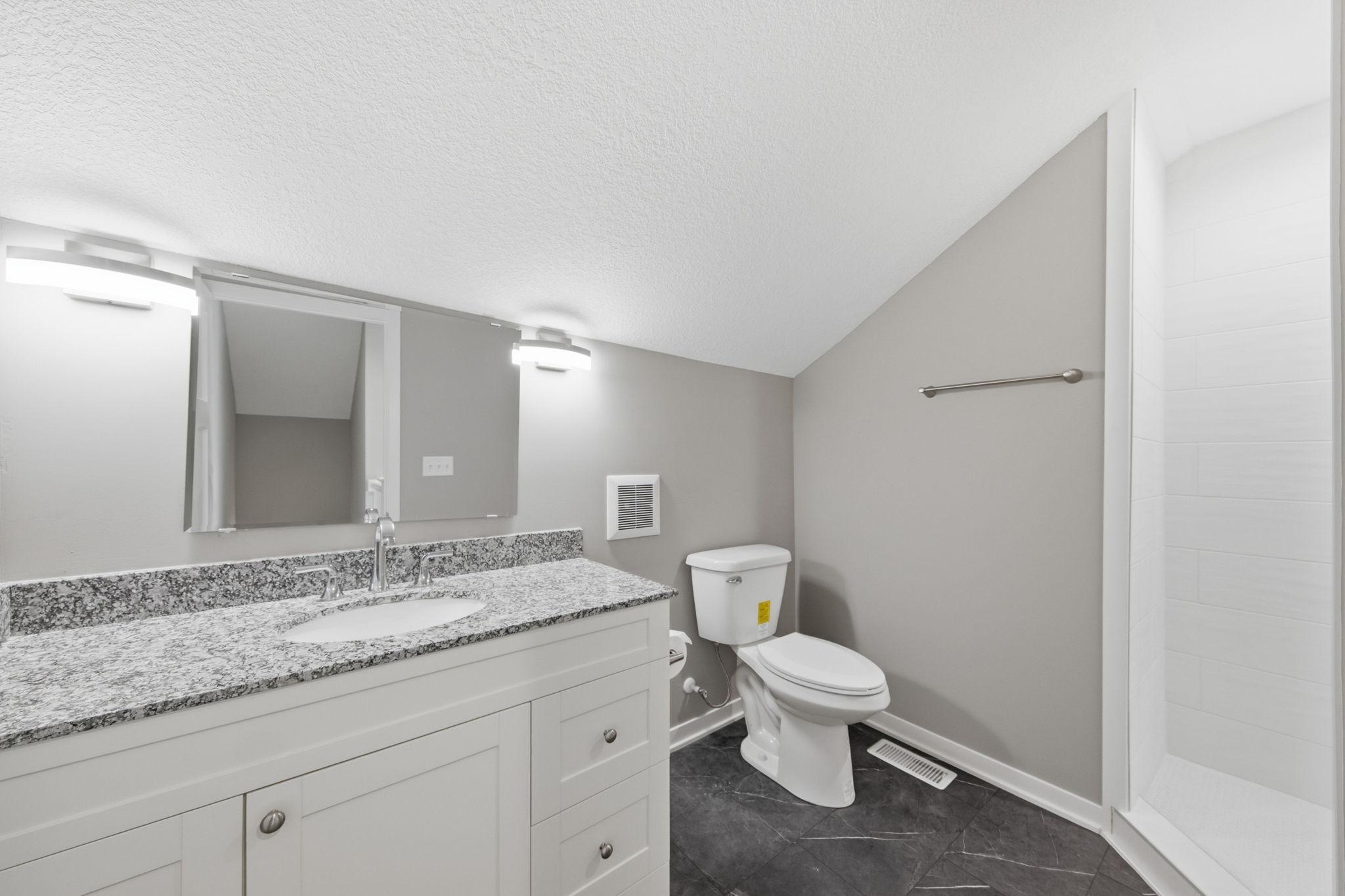 Upstairs you will find a beautifully redone 3/4 bathroom.