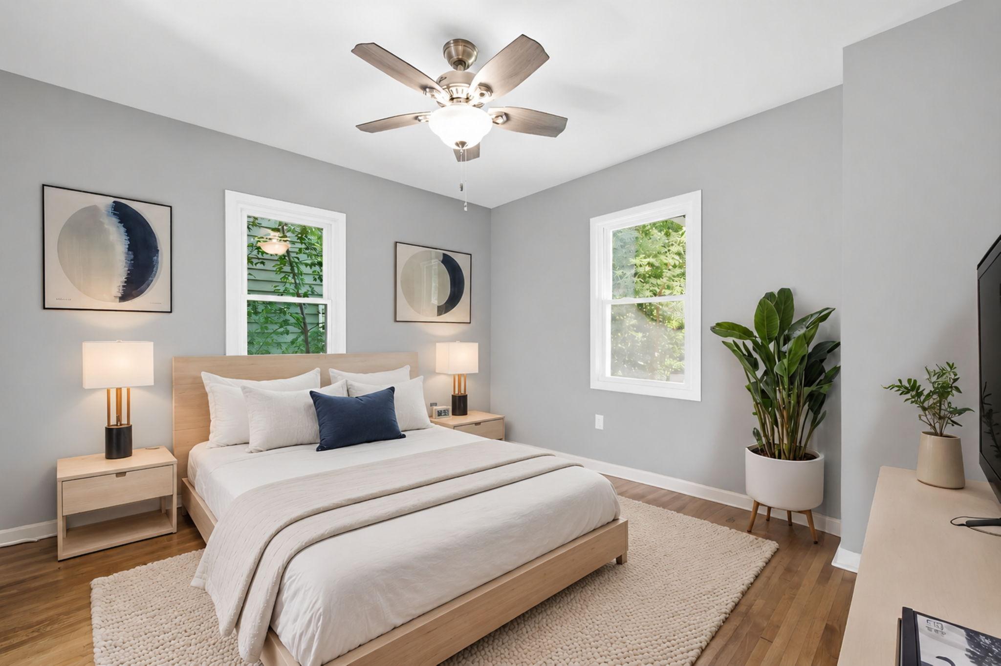 The main floor primary bedroom offers plenty of space to relax