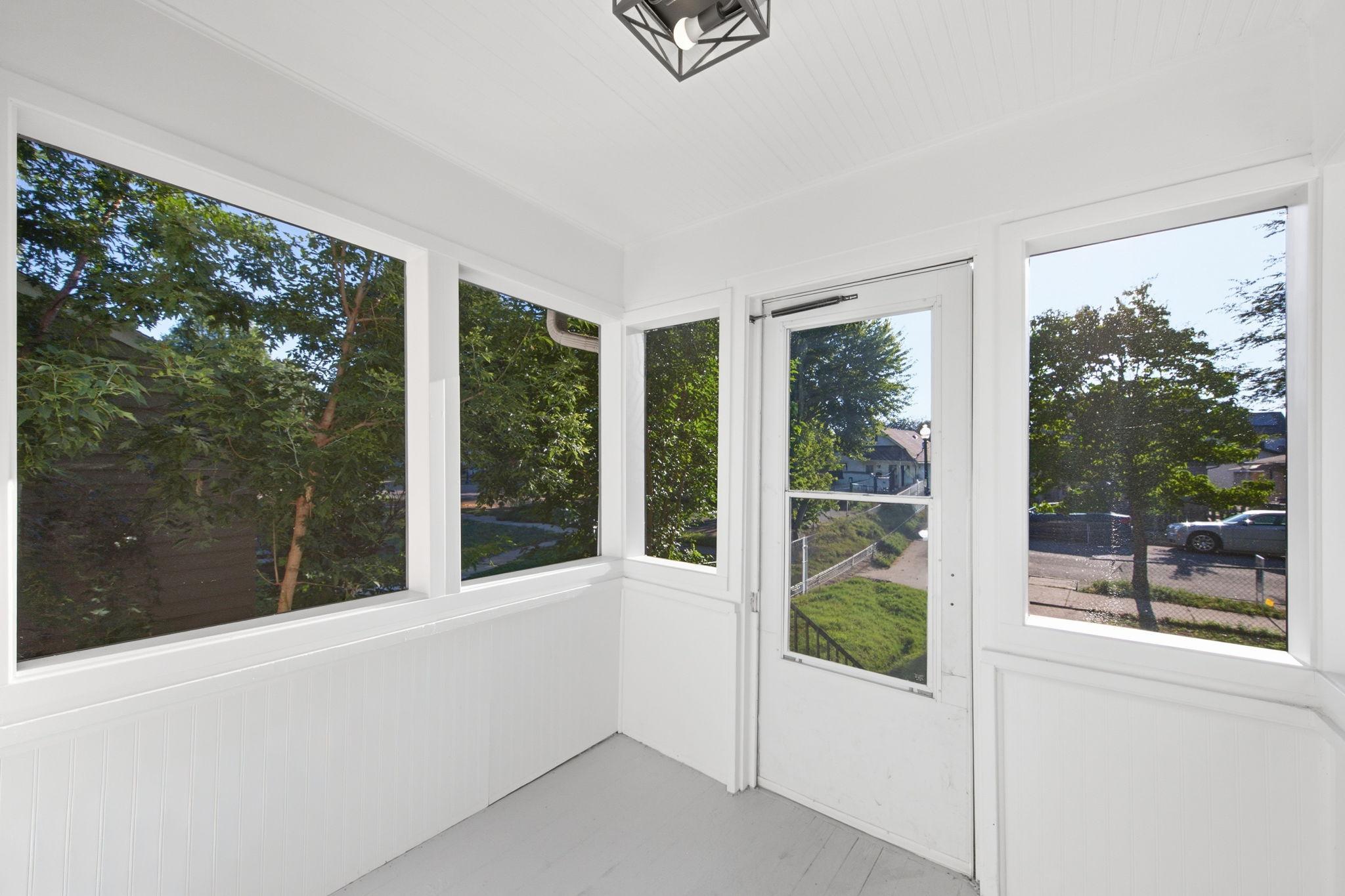 Kick off your shoes and enjoy the fresh air on this screened in porch