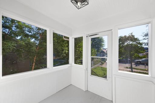 Kick off your shoes and enjoy the fresh air on this screened in porch