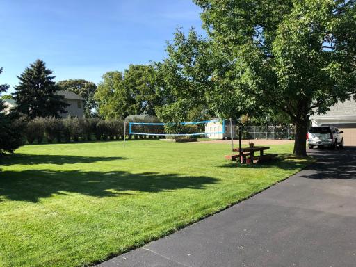 A professional volleyball area and picnic table!