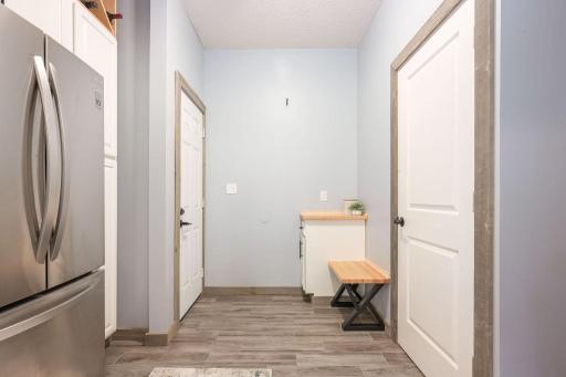 Mudroom entry with bench and built-in cabinets
