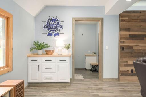 Recreation Room flows into the mudroom area and main level bedroom area.