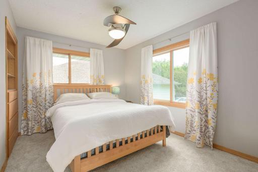 Upper-level 2nd Bedroom with built-in shelving and walk-in closet