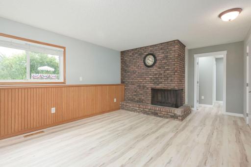 Beauitful brick wood-burning fireplace in Family Room