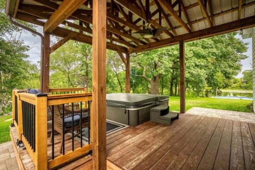 Back covered porch - hot tub with beautiful backyard and lake views!