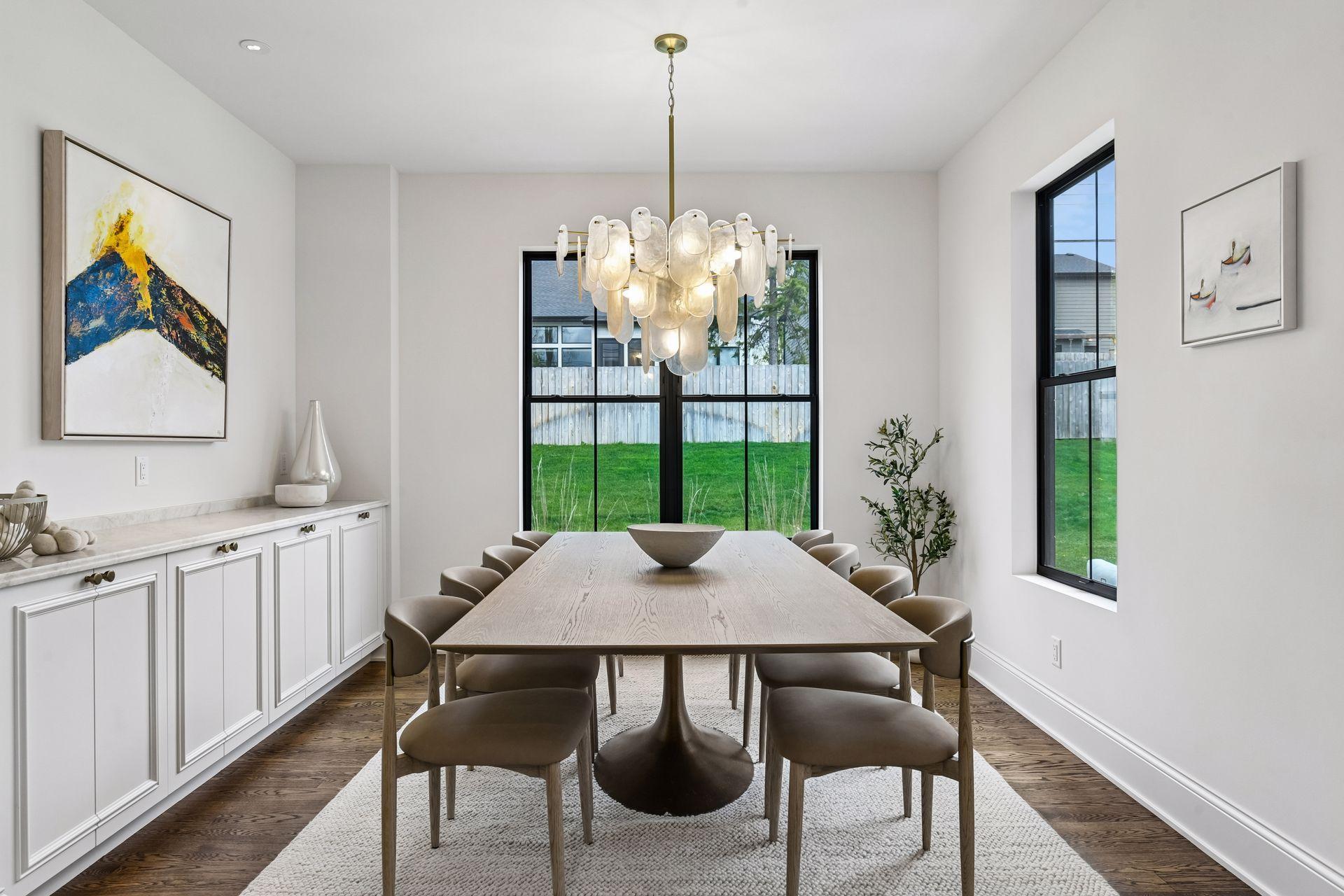 Dining room features built in buffet and Regina Andrew lighting