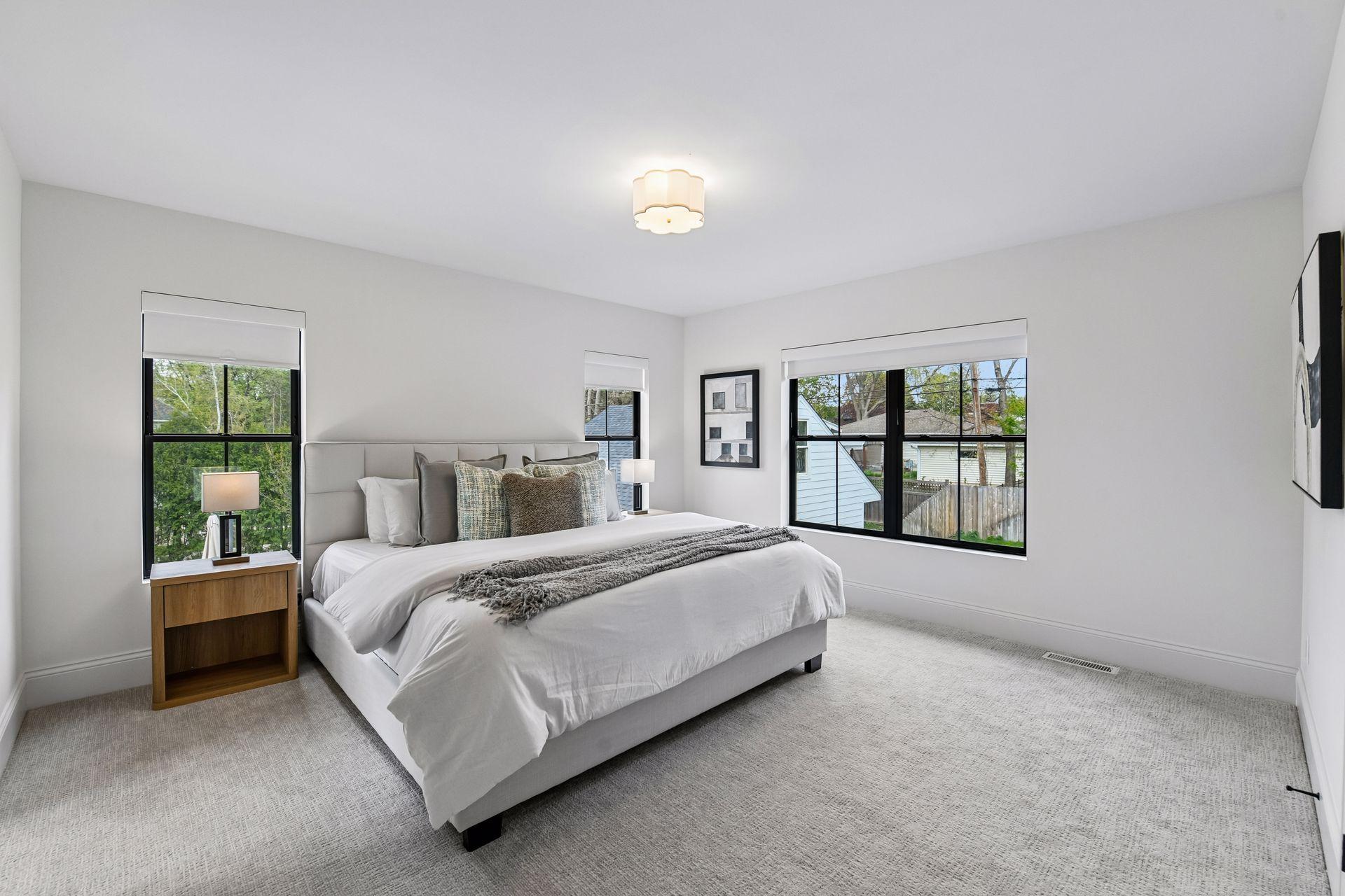 Large ensuite bedroom off the back of the home with large walk in closet and spa like bathroom