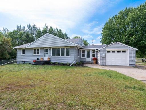 Charming rambler on 1/2 acre lot, nestled amongst mature trees on the Carver Bluffs.