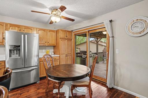 Kitchen easily flows onto deck with pergola