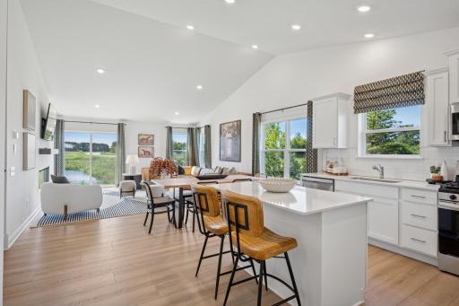 (Photo of a model home, finishes will vary) The dining area sits between the kitchen and Great Room and is ready for everything from family meals to game nights.