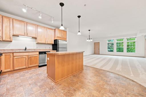 open concept kitchen, living and dining room