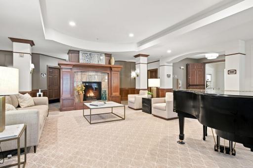 Fireside Lounge Seating/Piano area of the front lobby. Restrooms are behind the firesplace and the Fireside Room is through the doorway to the right