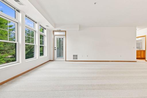 view from living room to screened in deck