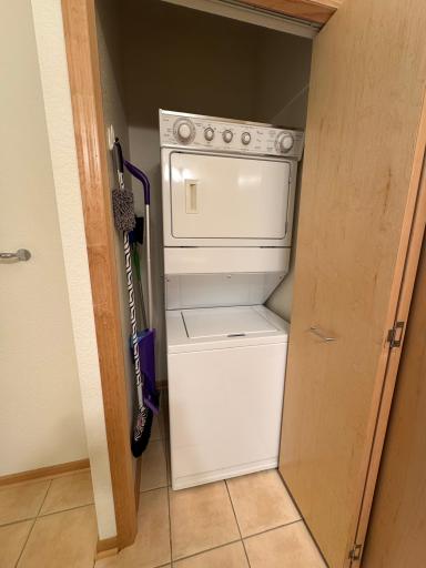 In unit stacked washer/dryer combo is located in the bathroom.