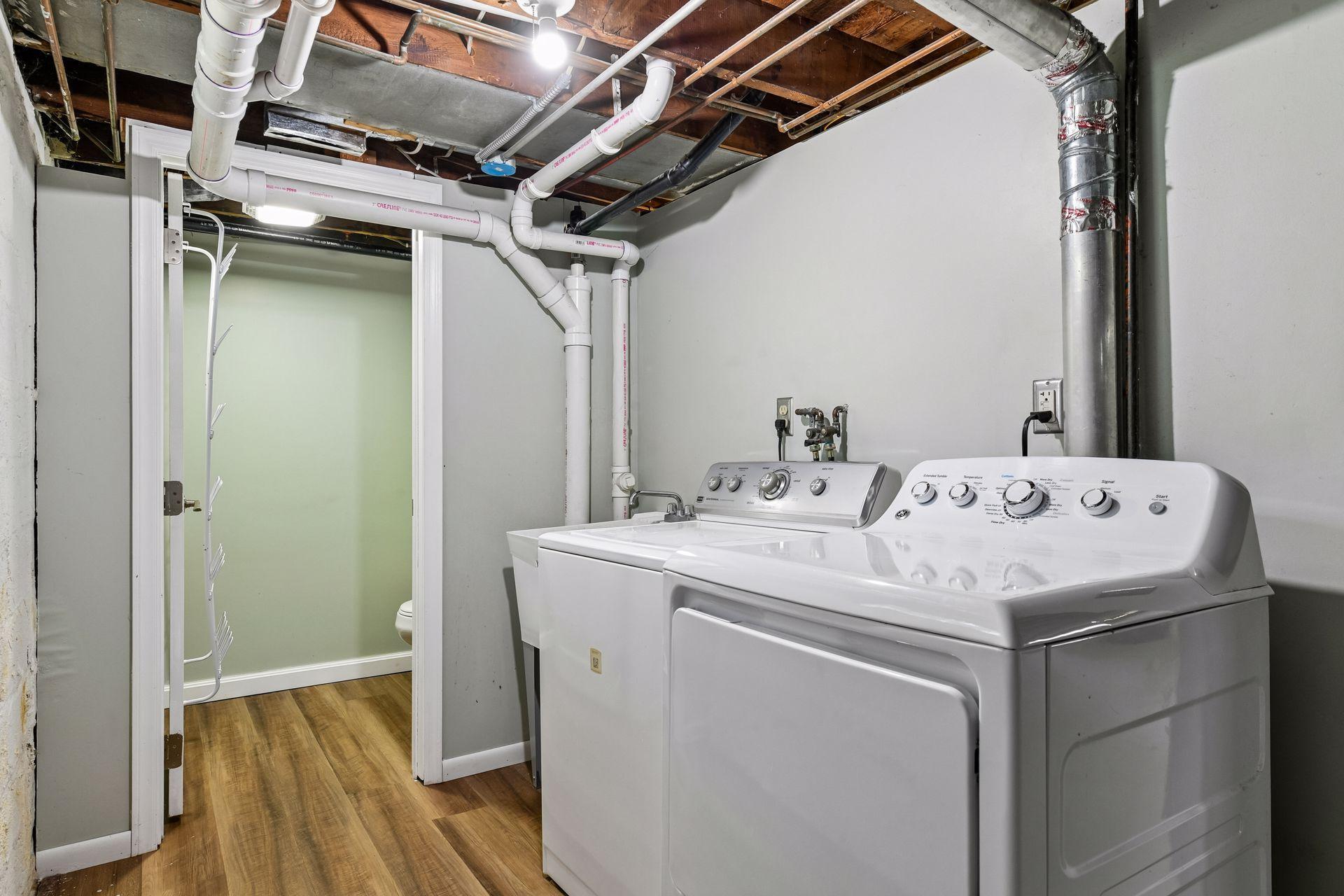 The lower level offers ample storage, laundry, and half bathroom.