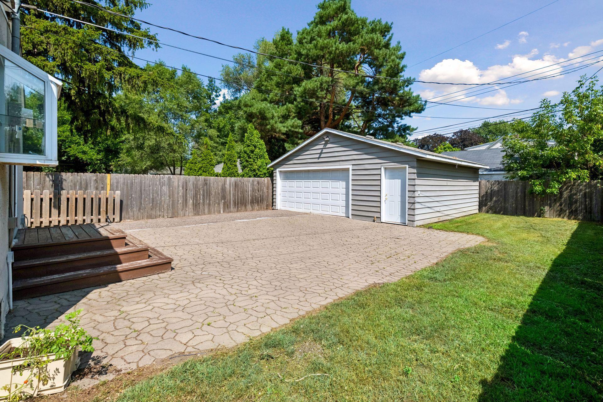 Outside, enjoy the backyard patio and two-car detached garage.