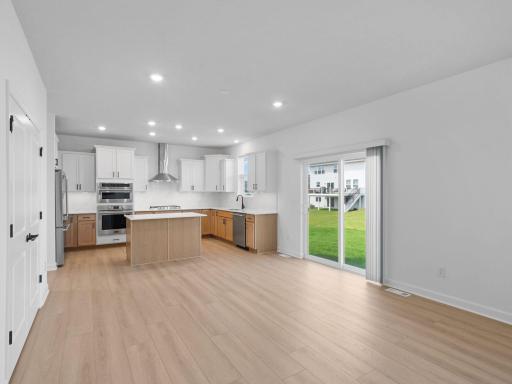 The breakfast room is situated among the open floorplan, allowing for effortless flow between rooms.