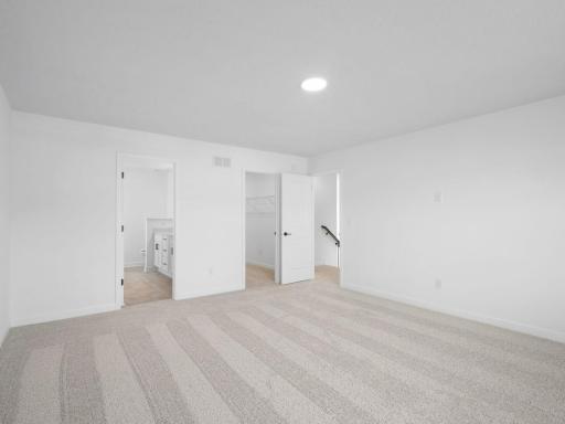 Plush wall-to-wall carpeting feels comfortable underfoot