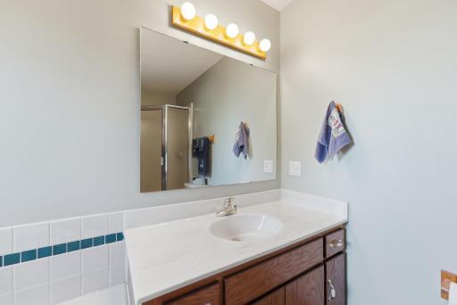 Vanity with storage space for bathroom essentials.