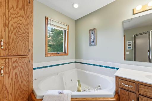 Relax and unwind in this jacuzzi tub.