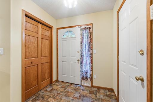 Functional foyer with space for coats, shoes, and other outdoor apparel.