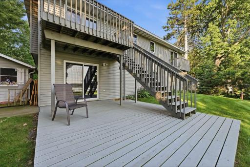 Expansive upper deck walks down to a lower deck, creating ideal spaces for entertaining and enjoying the outdoors.