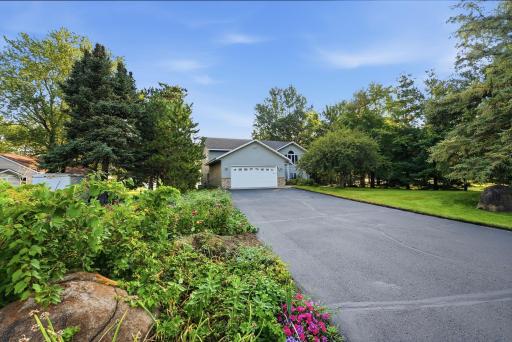 Mature trees enhance the property's beauty, privacy, and natural setting.