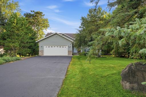 2 stall garage with driveway space for multiple vehicles.