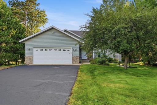 Driveway accommodates multiple vehicles.