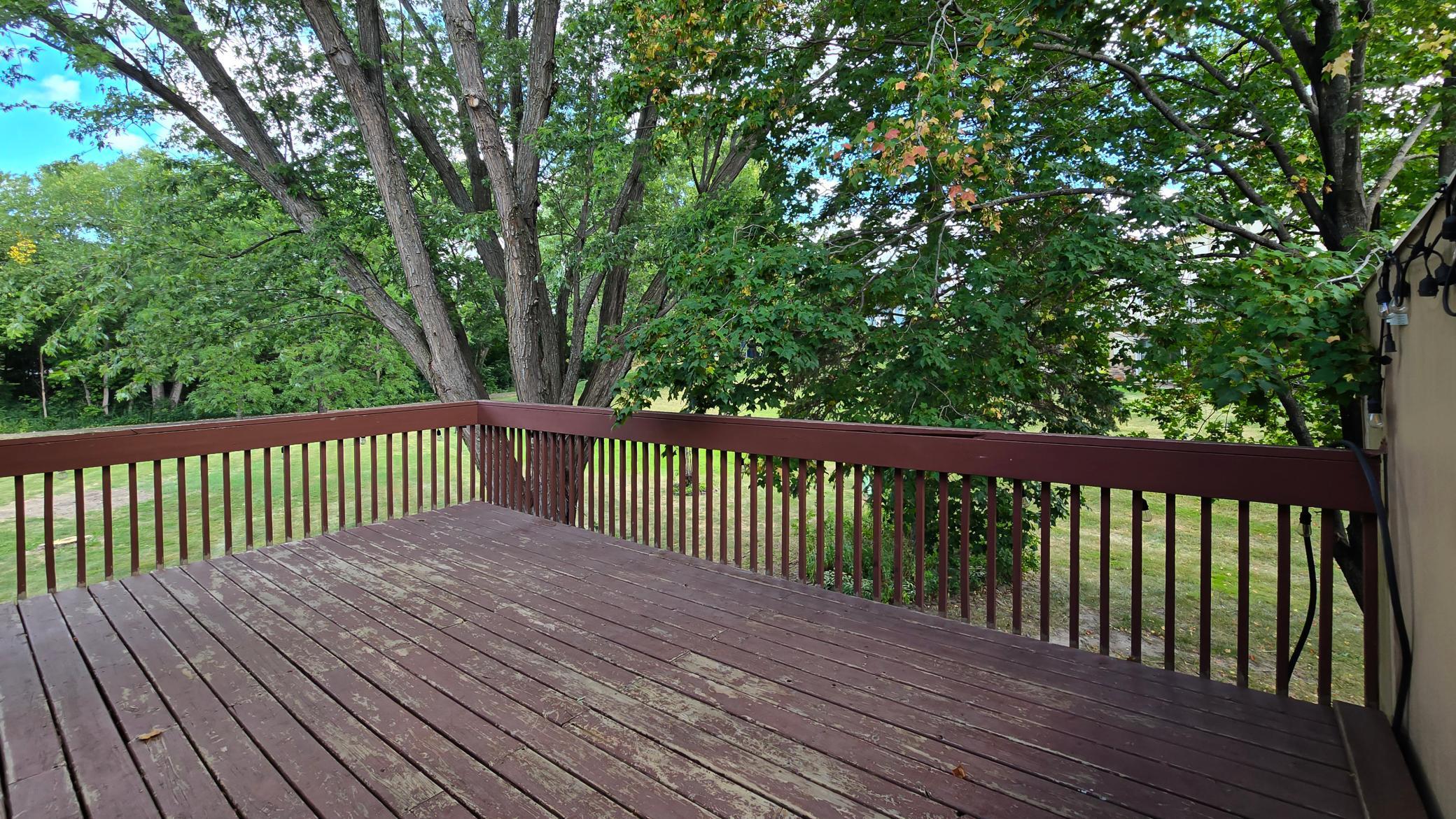 Generous wooden deck offering peaceful views—ideal for morning coffee or evening relaxation.