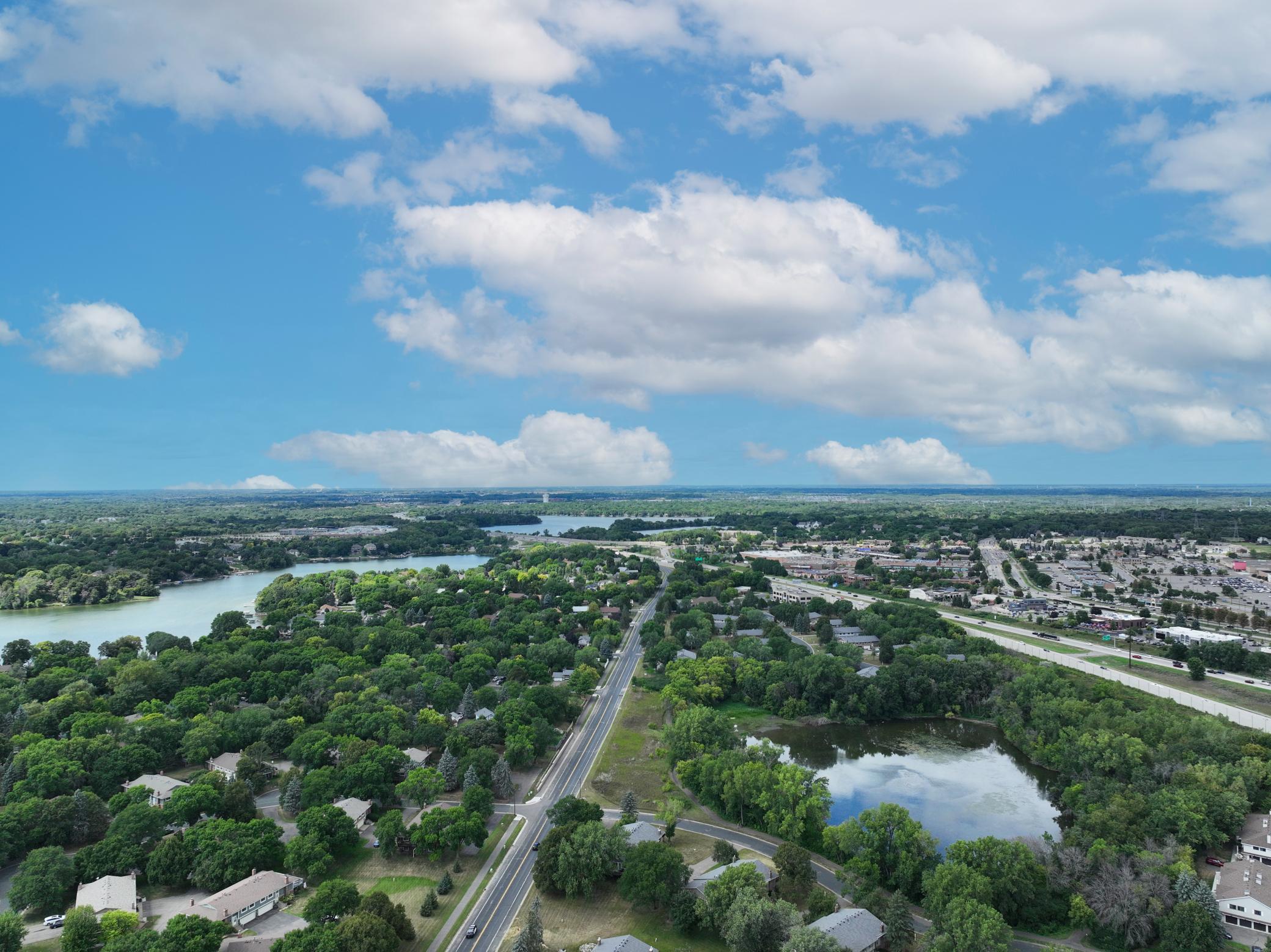Aerial view highlighting nearby roads, residential areas, and the surrounding landscape.